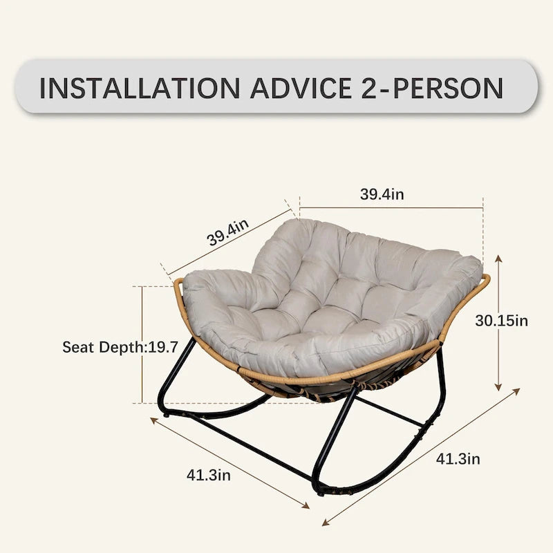 Fauteuil à bascule en rotin tressé gris foncé avec coussins et structure en métal