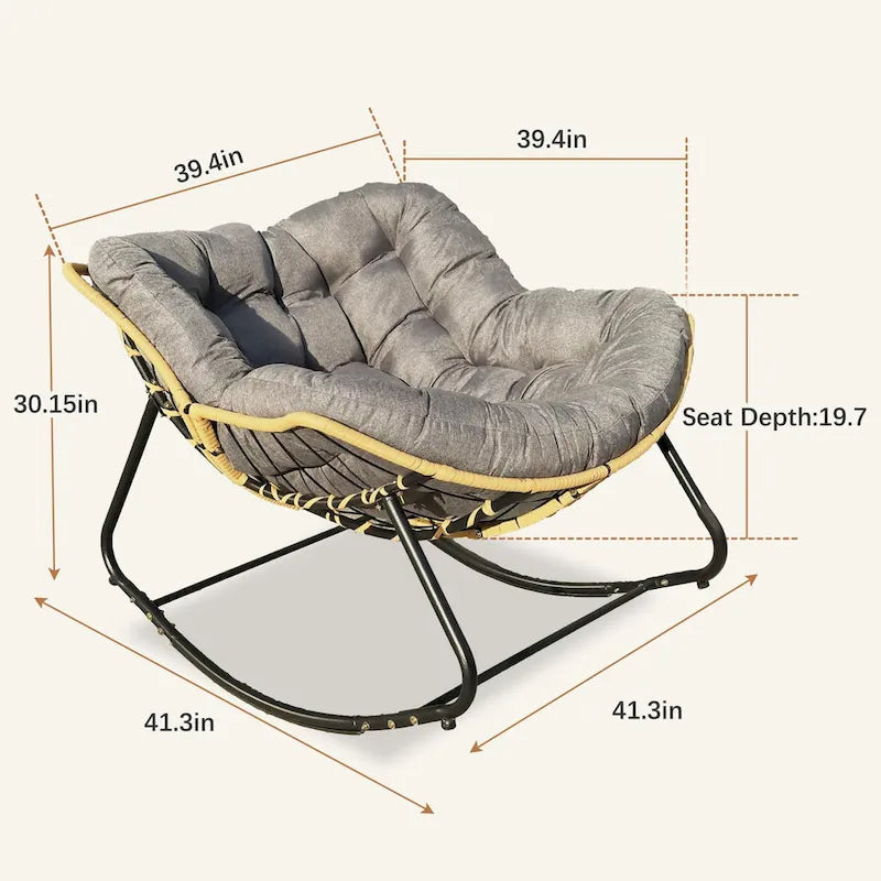 Fauteuil à bascule en rotin tressé gris foncé avec coussins et structure en métal