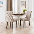 Chaise de salle à manger capitonnée en velours avec dossier à oreilles et clous décoratifs