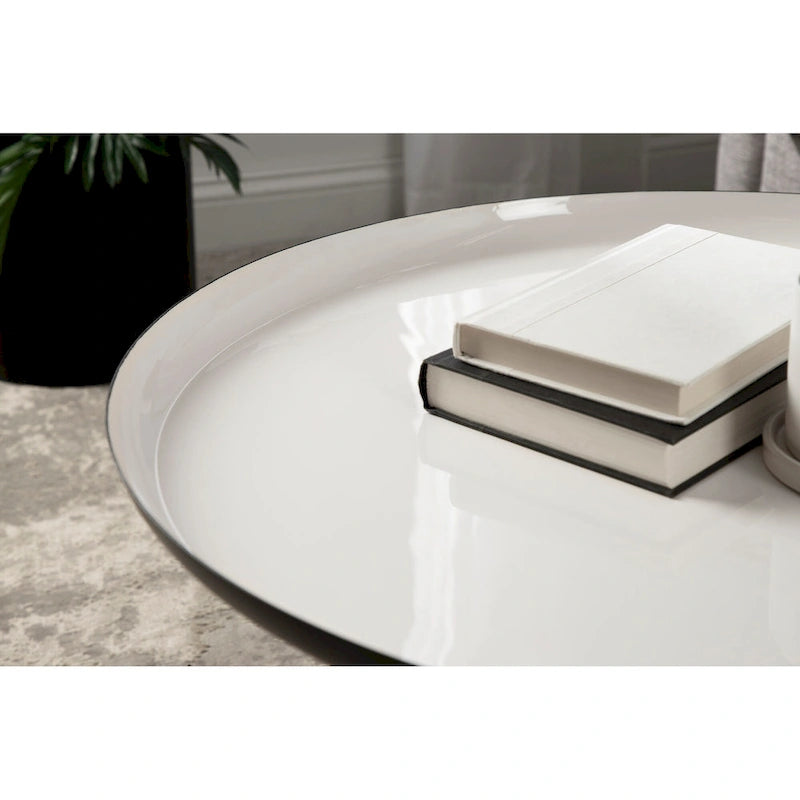 Table basse ronde en métal avec pieds trépied et finition émail bicolore blanc et noir