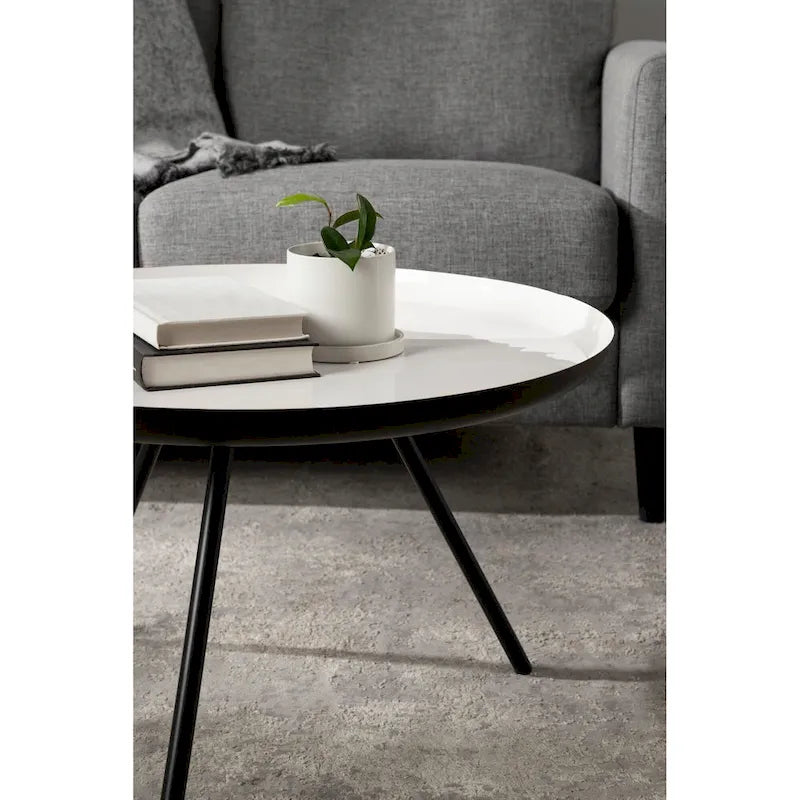 Table basse ronde en métal avec pieds trépied et finition émail bicolore blanc et noir