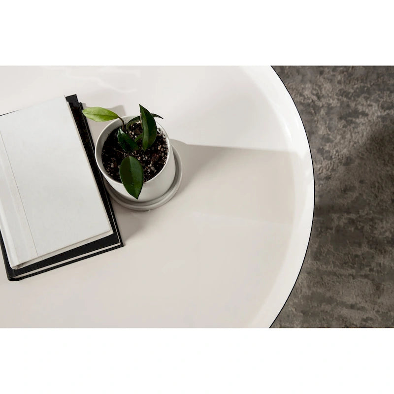 Table basse ronde en métal avec pieds trépied et finition émail bicolore blanc et noir