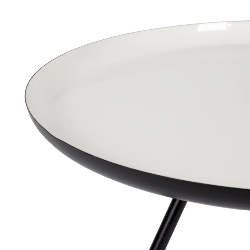 Table basse ronde en métal avec pieds trépied et finition émail bicolore blanc et noir